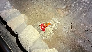 This photo provided by Carlsbad Caverns National Park shows a bag of Cheetos that was dropped off trail by a visitor in the Big Room at the national park near Carlsbad, N.M.