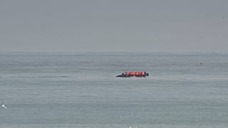 FILE - A boat thought to be with migrants is seen in the sea near the Wimereux beach, France, Wednesday, Sept. 4, 2024