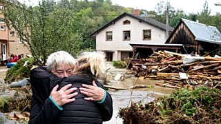 A resident hugs with her relative after being evacuated from her flooded house in Jesenik, Czech Republic, Sunday, Sept. 15, 2024.