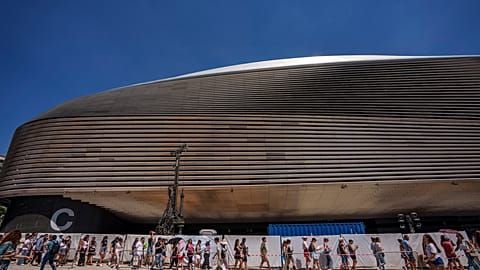 Fans queue for Taylor Swift's concert outside Madrid's Santiago Bernabeu stadium in May 2024