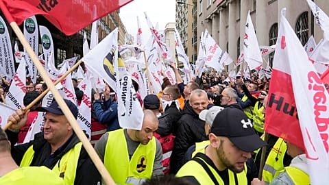 Some 300 Polish coal miners angered by the European Union directive reducing methane emissions protest noisily before the EU office saying it will deprive them of their jobs.