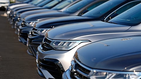 A long row of unsold 2024 Tiguan utility vehicles are shown Sunday, July 28, 2024, at a Volkswagen dealership in Denver. 