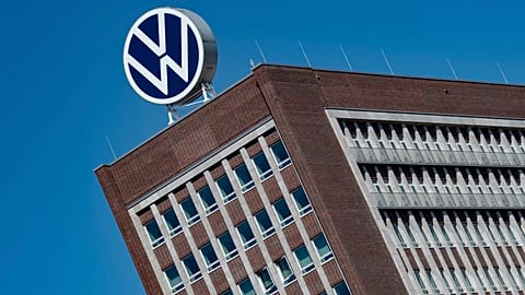 The Volkswagen logo stand on the top of a VW headquarters building in Wolfsburg, Germany
