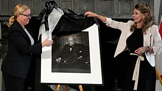 Canadian Cultural Heritage Deputy Minister Isabelle Mondou and Andrea Clark-Grignon, Head of Public Affairs, unveil 'The Roaring Lion,' a 1941 portrait of Winston Churchill