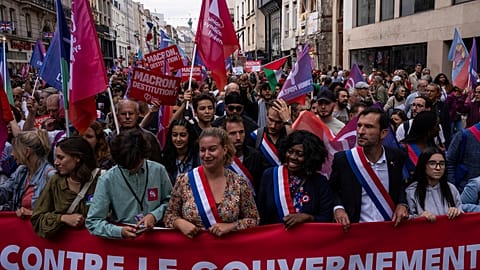 Demonstrators take part in a protest against the new French Prime Minister Michel Barnier and the government, in Paris, France, Saturday, Sept. 21, 2024.