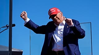 Republican presidential nominee former President Donald Trump dances after speaking at a campaign rally at Wilmington International Airport, Saturday, Sept. 21, 2024.