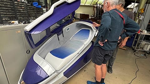 Dr Philip Nitschke, front, stands next to a "suicide pod" known as "The Sarco" in Rotterdam, The Netherlands, July 8, 2024.
