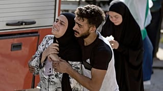 A woman reacts at the scene of an Israeli airstrike in the town of Maisara, north of Beirut, 25 September 2024