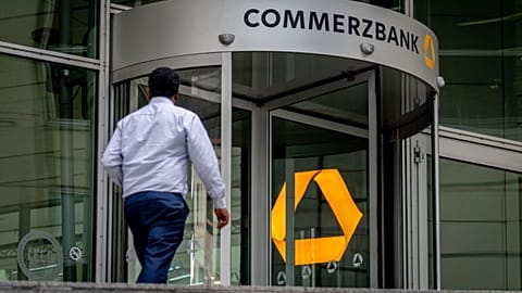 A man walks towards the entrance of the headquarters of the Commerzbank in Frankfurt, Germany. 24 Sept., 2024. 
