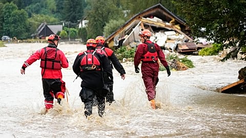  Firefighters walk through a flooded road in Jesenik, Czech Republic, 15 September 2024