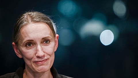 Natallia Hersche speaks to the media at the Zurich Airport, Switzerland, on Friday, Feb. 18, 2022. 