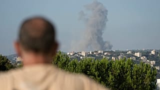 Smoke rises from an Israeli airstrike north of Beirut, in the village of Ras Osta, Byblos district, seen from Maaysrah, Lebanon, Wednesday, September 25, 2024. 