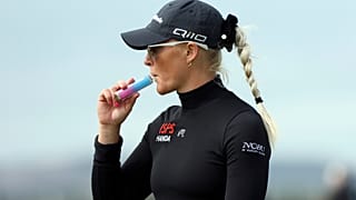 England's Charley Hull vapes on her way to the 3rd tee during the first round of the Women's British Open golf championship, in St Andrews, Scotland Thursday, Aug. 22, 2024.