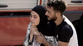 Uma mulher reage no local de um ataque aéreo israelita na cidade de Maisara, a norte de Beirute, 25 de setembro de 2024