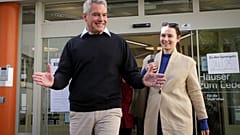 Austrian Chancellor Karl Nehammer smiles while exiting a polling station in Vienna, Austria, Sunday, Sept. 29, 2024, 