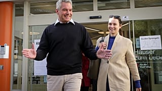 Austrian Chancellor Karl Nehammer smiles while exiting a polling station in Vienna, Austria, Sunday, Sept. 29, 2024, 
