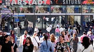 People walk on a shopping street in Essen, Germany