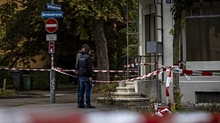 Police officers at the scene of an attack in Zurich's Oerlikon district.