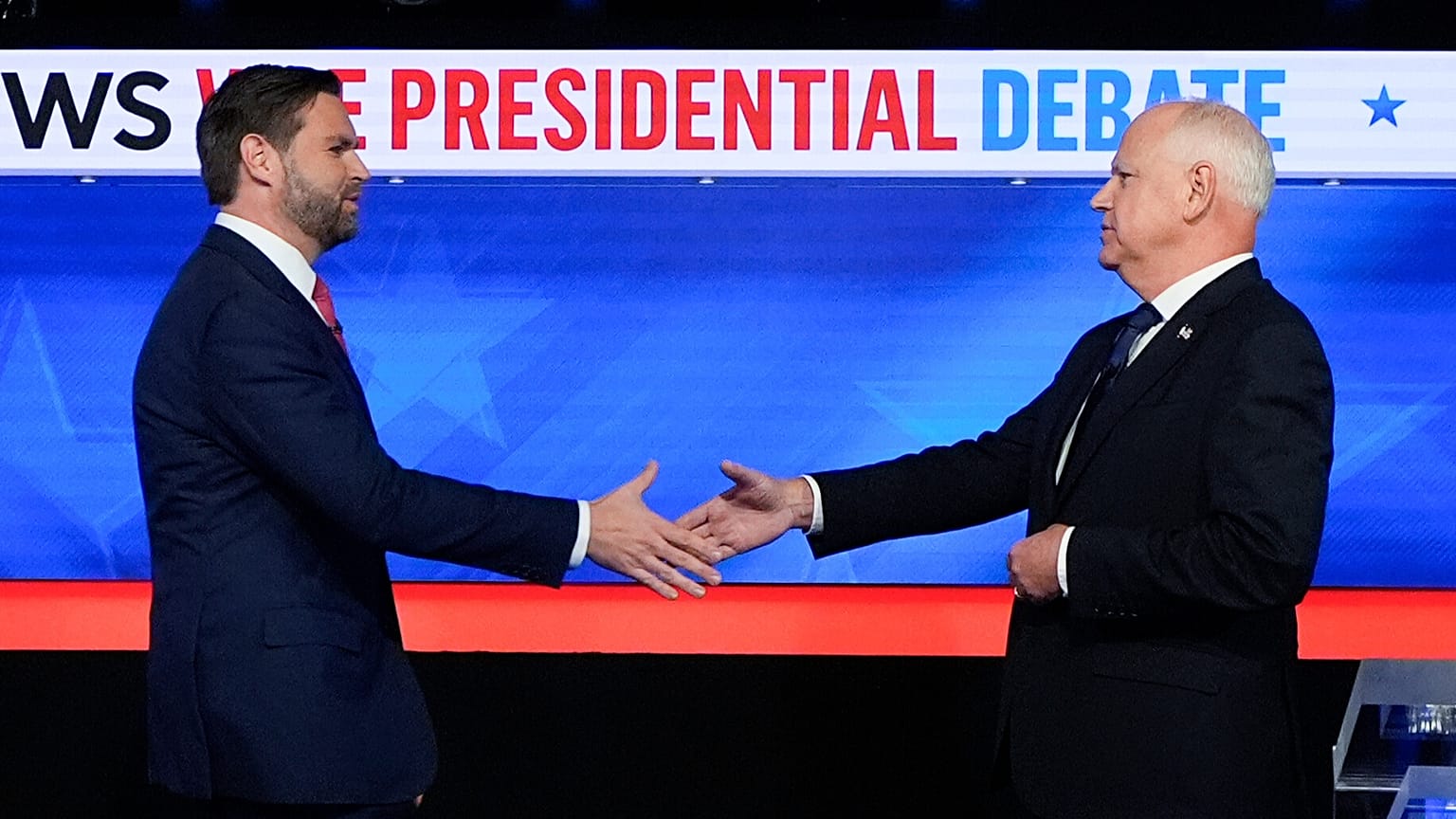 US election running mates JD Vance (left) and Tim Walz arrive for their televised debate.