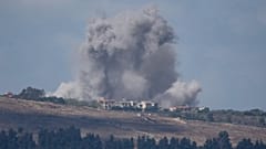 An Israeli airstrike hits an area in southern Lebanon as seen from northern Israel, 2 October 2024