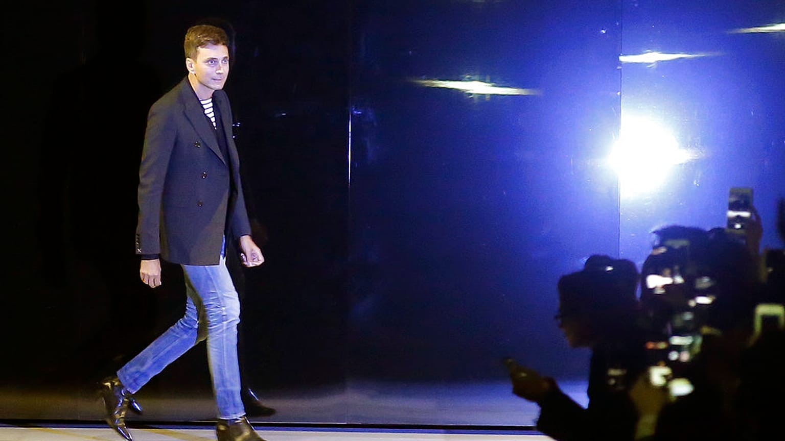 Hedi Slimane accepts applause at the end of the Celine Spring/Summer 2019 ready to wear fashion collection