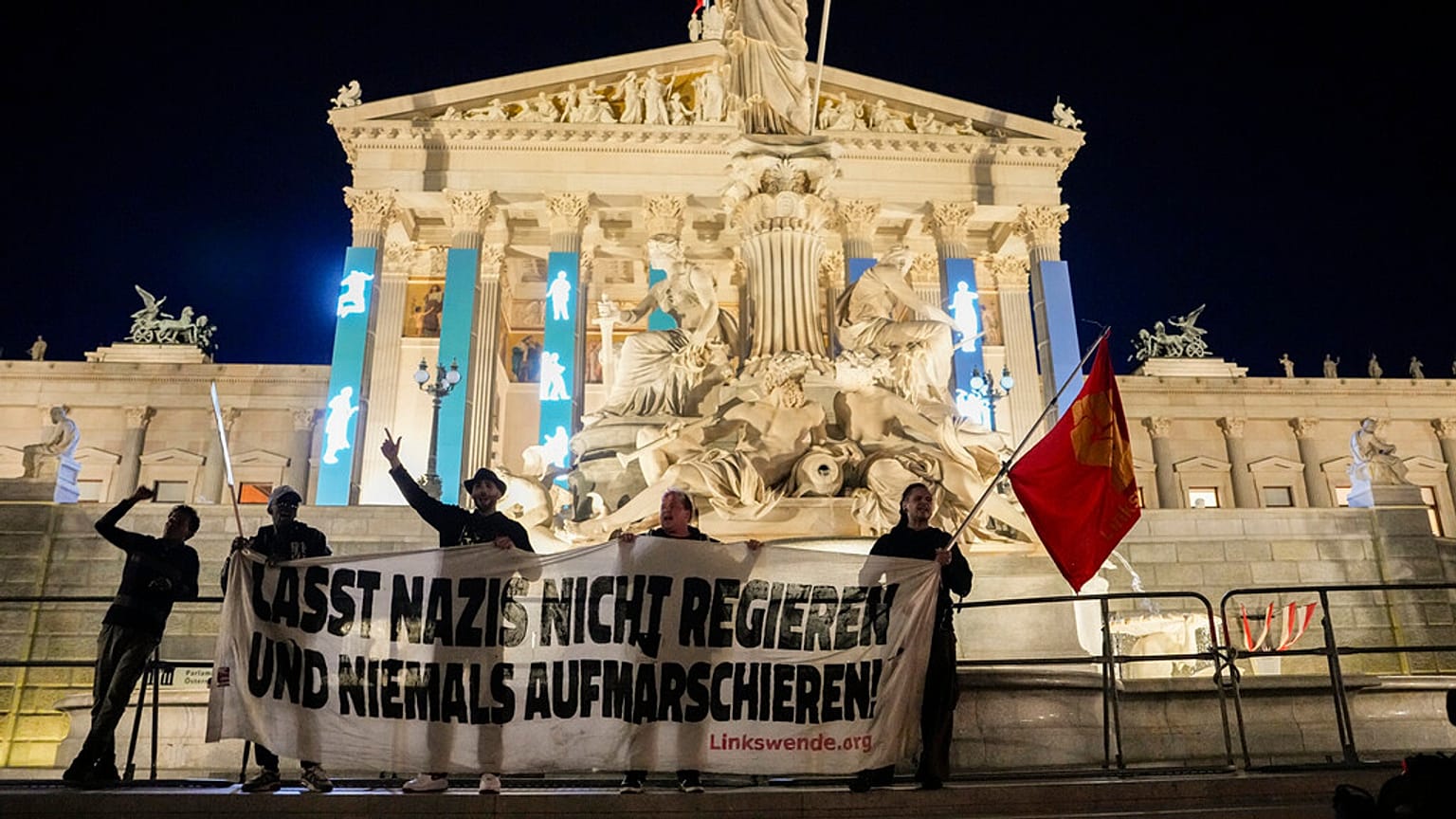 Anti right wing protesters shout slogans and hold an banner that reads "Don't let Nazis rule and never let them march" in Vienna, Austria, Sunday, Sept. 29, 2024,