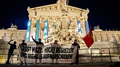 Anti right wing protesters shout slogans and hold an banner that reads "Don't let Nazis rule and never let them march" in Vienna, Austria, Sunday, Sept. 29, 2024,
