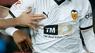 FILE: Barcelona's Robert Lewandowski fights for the ball with Valencia's Cristhian Mosquera during a Spanish La Liga match, 29 April 2024