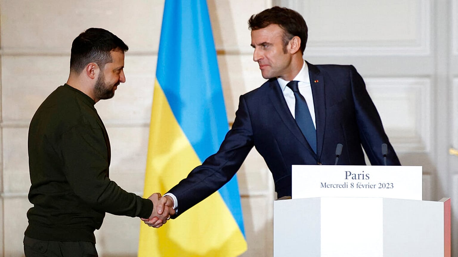FILE - French President Emmanuel Macron shakes hands with Ukrainian President Volodymyr Zelenskyy, during a press conference in 2023