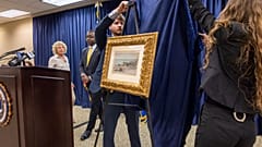 FBI agents unveil a Claude Monet painting to its original owners' descendants at the New Orleans office on Wednesday, 9 October 2024.