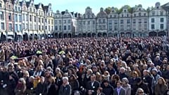Attendees of a tribute ceremony for Domonique Bernard one-year on from his murder in the northern French town of Arras, on 13 October, 2024.