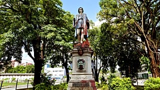 FILE - A vandalised statue of Christopher Columbus towers over Columbus Square in Port of Spain, Trinidad and Tobago, on Wednesday, 28 August, 2024.