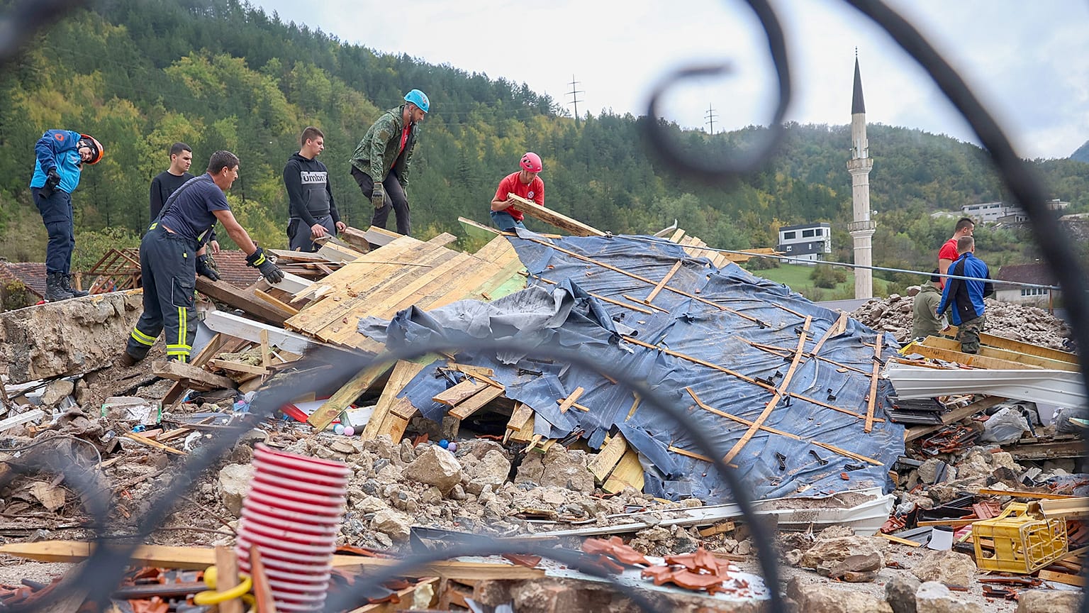 Rescuers search for missing people after floods and landslides in the village of Donja Jablanica, 5 October 2024
