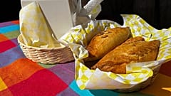 A basket of Mexican pastes sit on a patron's table before they are eated for lunch at the 16th International Paste Festival in Mineral del Monte
