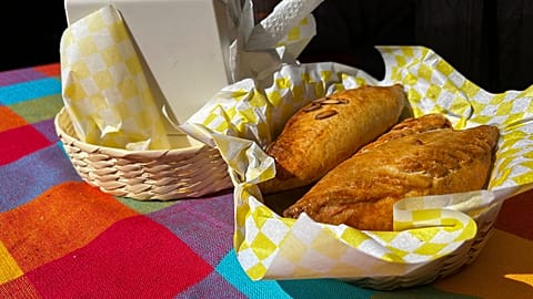 A basket of Mexican pastes sit on a patron's table before they are eated for lunch at the 16th International Paste Festival in Mineral del Monte