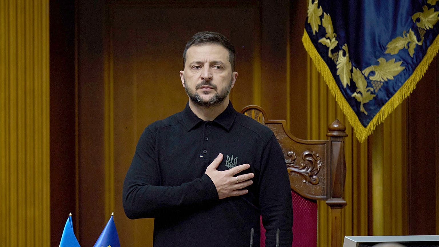 Ukraine's President Volodymyr Zelenskyy listens to the national anthem before his speech at Verkhovna Rada in Kyiv, 16 October 2024