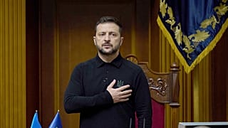 Ukraine's President Volodymyr Zelenskyy listens to the national anthem before his speech at Verkhovna Rada in Kyiv, 16 October 2024