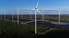 Wind turbines operate at the Klettwitz Nord solar energy park near Klettwitz, Germany on Tuesday