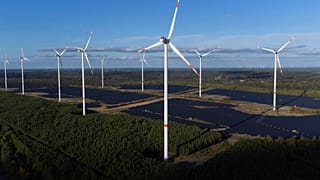 Wind turbines operate at the Klettwitz Nord solar energy park near Klettwitz, Germany on Tuesday