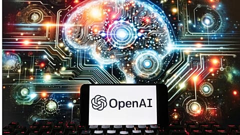 FILE - The OpenAI logo is displayed on a cell phone with an image on a computer screen generated by ChatGPT's Dall-E text-to-image model, Dec. 8, 2023, in Boston.