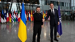 NATO Secretary General Mark Rutte, right, shakes hands with Ukraine's President Volodymyr Zelenskyy prior to a meeting at NATO headquarters in Brussels, Thursday, Oct. 17, 202