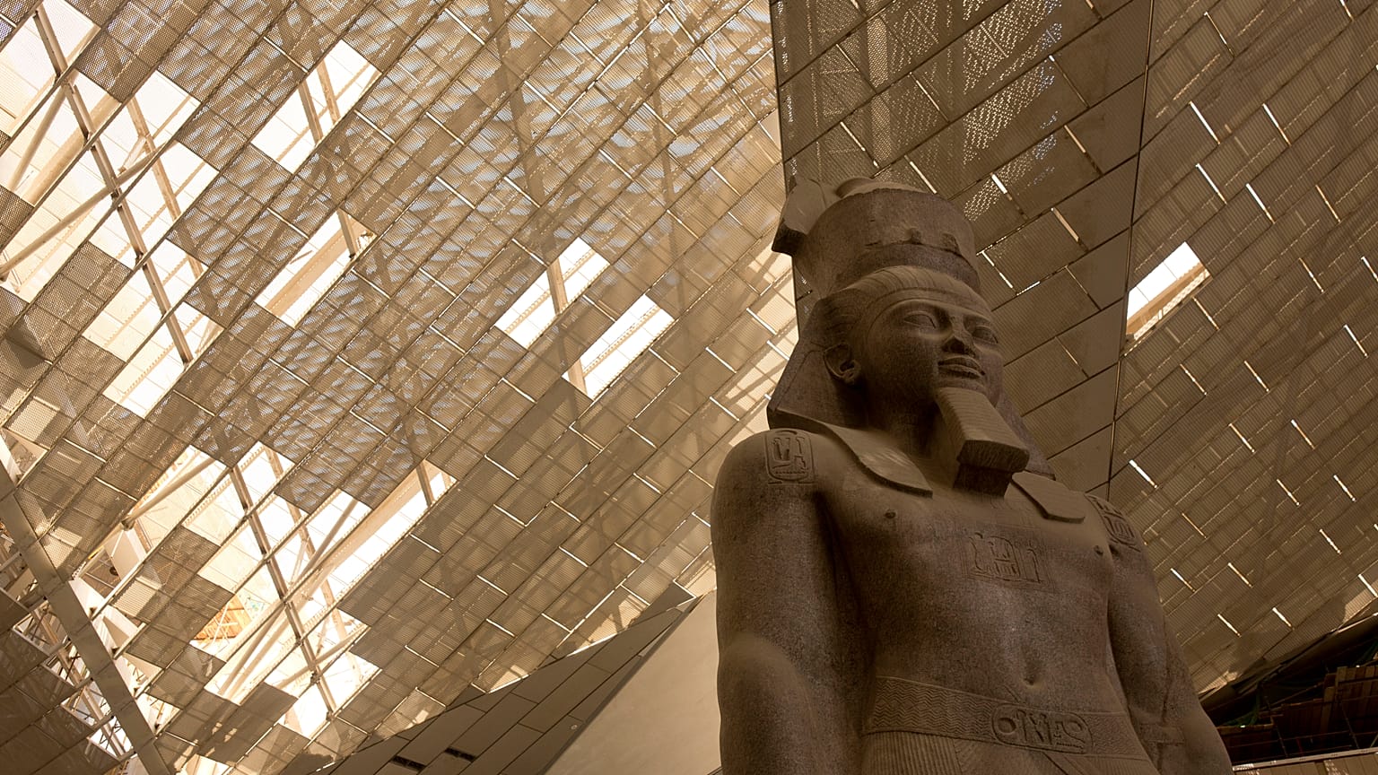A giant stone figure of Ramses II stands in the Grand Egyptian Museum in Giza, near Cairo, Egypt