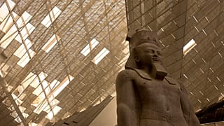 A giant stone figure of Ramses II stands in the Grand Egyptian Museum in Giza, near Cairo, Egypt