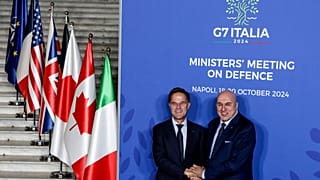 Italy's Defense Minister Guido Crosetto, right, welcomes NATO Secretary General Mark Rutte at the G7 Ministers' Meeting on defense in Naples, Italy, Saturday, Oct. 19, 2024.