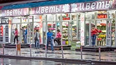 FILE: Street shops vendors wait for customers at their flowers shops in Moscow, 27 July 2015