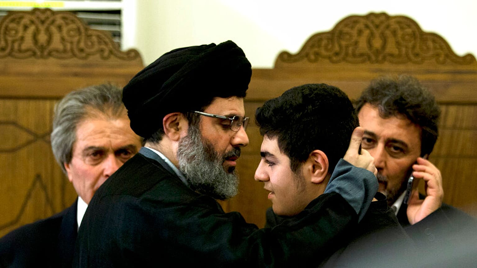 FILE - In this May 13, 2016 file photo, Hashem Safieddine, head of Hezbollah's executive council, second left, is seen in a southern suburb of Beirut, Lebanon. 