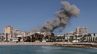 Smoke rises from buildings hit in an Israeli airstrike in Tyre, Lebanon, Wednesday