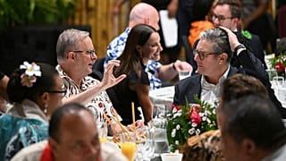 Australia's Prime Minister Anthony Albanese, left, talks with British Prime Minister Keir Starmer during a State Banquet during the Commonwealth Heads of Government Meeting.