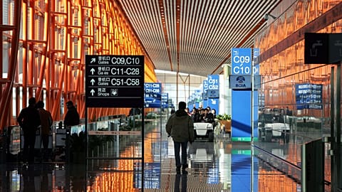 Workers walk through the new Terminal 3 building at Beijing Airport Tuesday Feb. 26, 2008. 