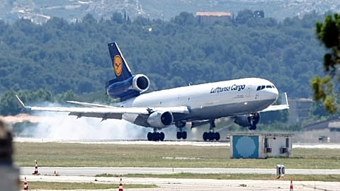 A Lufthansa plane lands to transfer the remains of the victims of the Germanwings aircraft crash to Barcelona in Spain, at Marseille airport, France , Monday, June 15, 2015. 